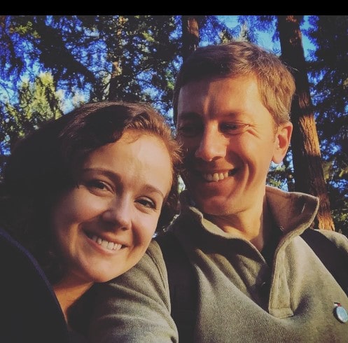 Picture of Arianwen Parkes-Lockwood with her husband Marcello Fabrizi posing for a photoshoot wearing brown color jacket